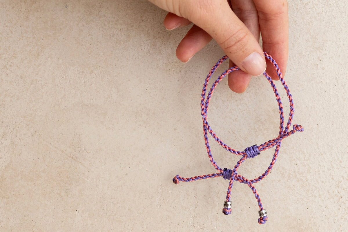 El Camino Coral and Lavender Journey Bracelets. The friendship bracelet that is designed to be shared with people you meet on your travels. The perfect gift for anyone who loves to travel.