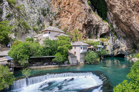 The waterfall and turquoise water flowing past Dervish house