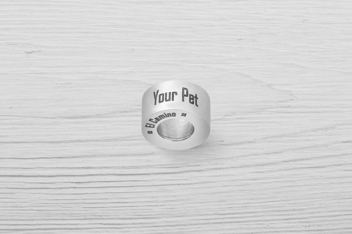 El Camino Custom Paw Step is a Charm that allows you to personalise a bead with your pets name. Showing side 2.