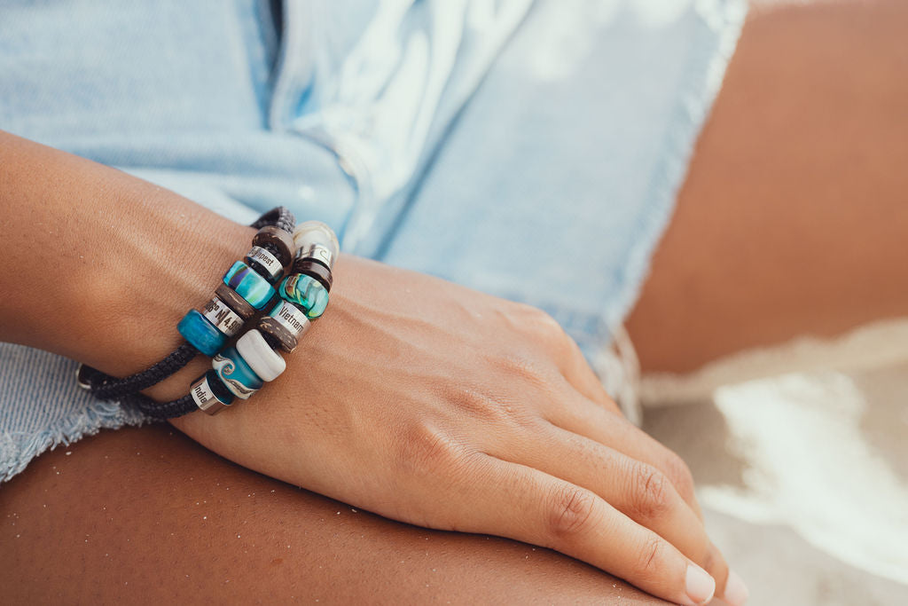 El Camino Black Bracelet with Whale, Custom, Northern Lights, Budapest, Snow/Ice, Vietnam, Jungle and Wave charms Steps travel memory beads